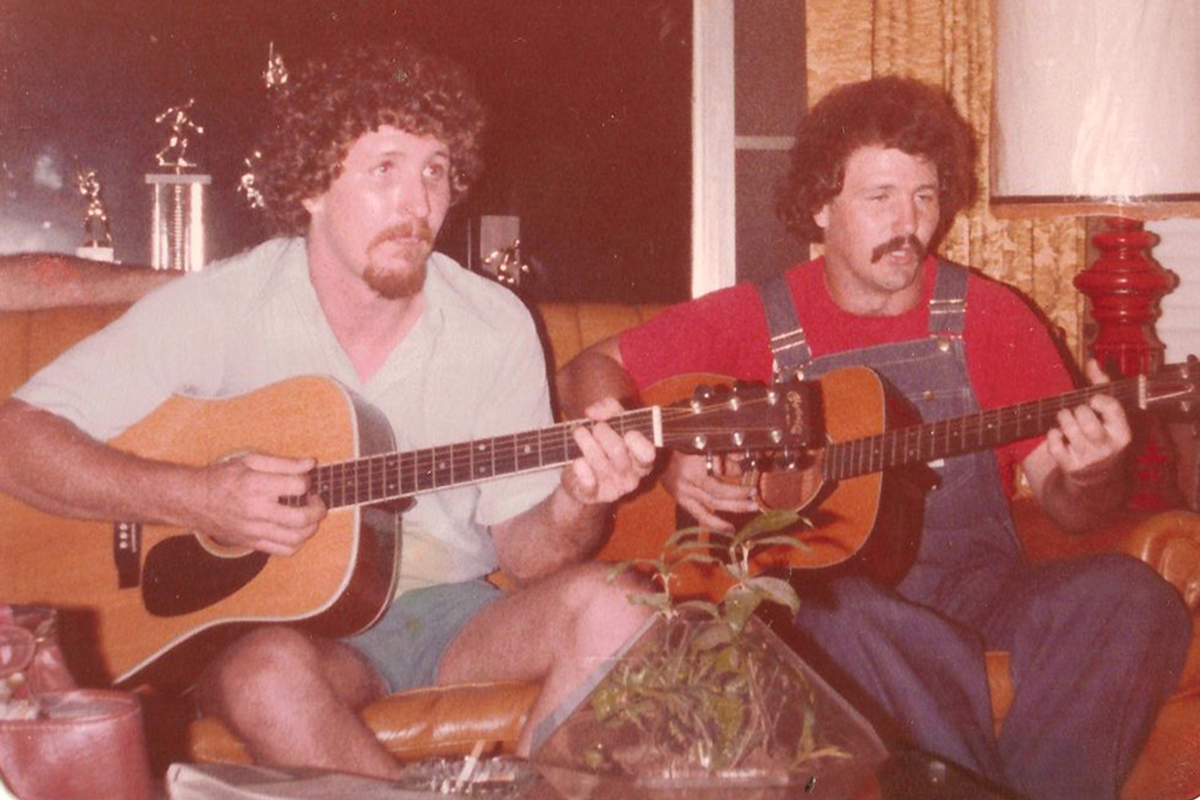 Phillip Stancil, right, plays guitar with his brother Danny Stancil.