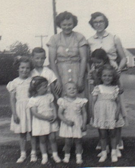 ADD Nona and Esther Godwin Narron stand in the back. From left, Nona's children: Linda, Jimmy Jr. and Sandy; and Emma Lee Godwin Cayton's children Peggy, Janie, with Nancy behind her.