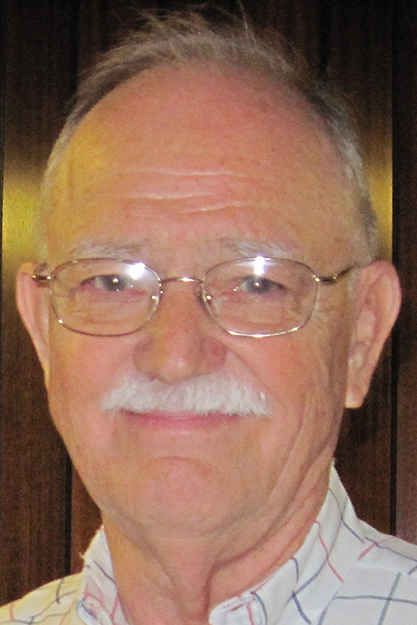 Bill Batts slightly smiles.