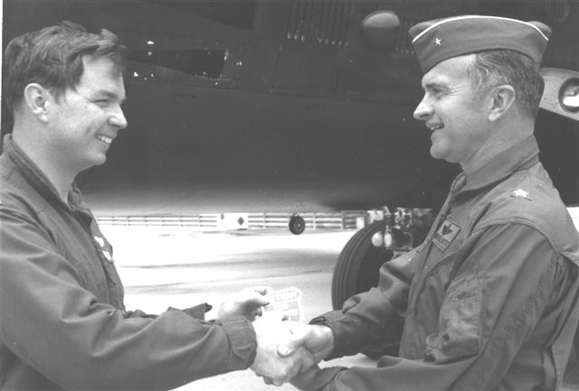 Jes Hales receiving 200th mission patch